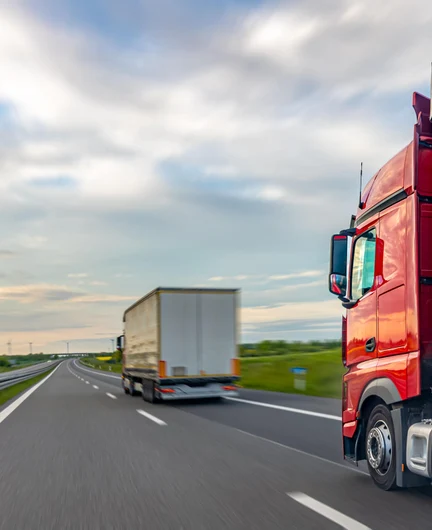 65129f82-013a-4654-a761-562cdb61bd56-red-truck-highway-freight-transport-logistics-route.jpg